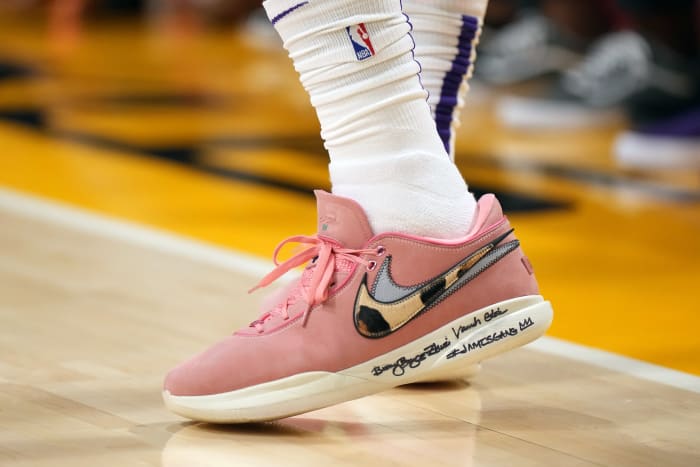 View of LeBron James' pink and white Nike shoes.